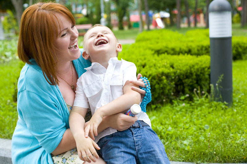 http://www.dreamstime.com/royalty-free-stock-photos-laughing-mother-her-four-year-old-son-portrait-happy-child-outdoors-image34811998