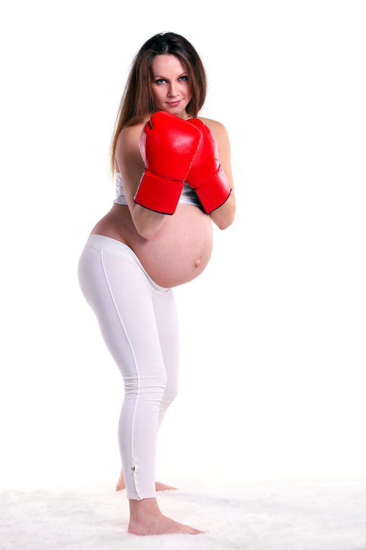 http://www.dreamstime.com/royalty-free-stock-images-young-pregnant-woman-pair-boxing-gloves-image25740449