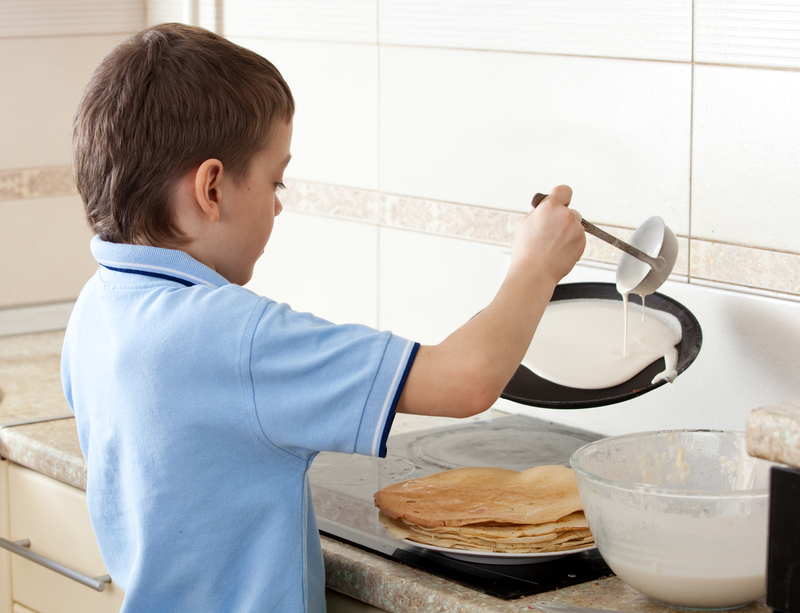 http://www.dreamstime.com/stock-images-boy-cooking-pancakes-image28712474