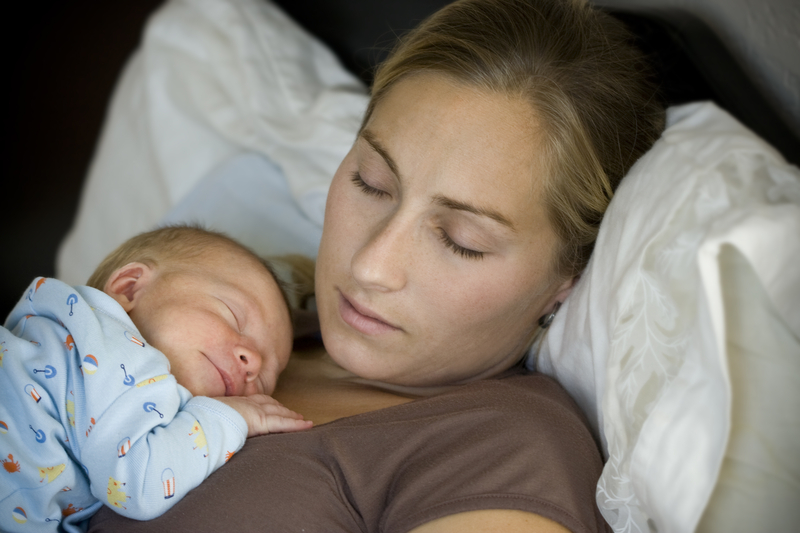 http://www.dreamstime.com/stock-images-sleeping-mother-child-image6582454