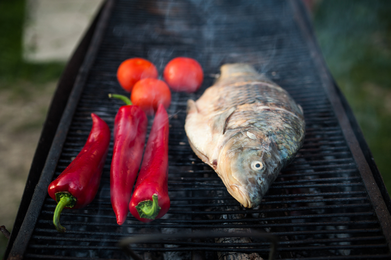 http://www.dreamstime.com/royalty-free-stock-photo-fish-grill-raw-freshwater-cooked-traditional-style-vegetables-image40340595