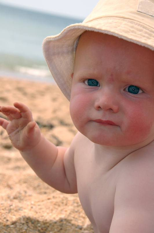 http://www.dreamstime.com/stock-photography-beach-baby-sunhat-image6411372