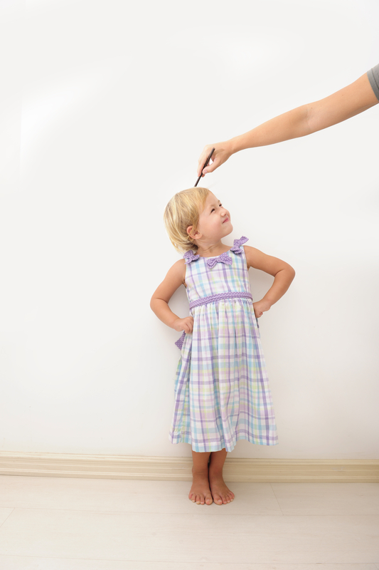 http://www.dreamstime.com/stock-images-mother-measuring-height-child-image15053034