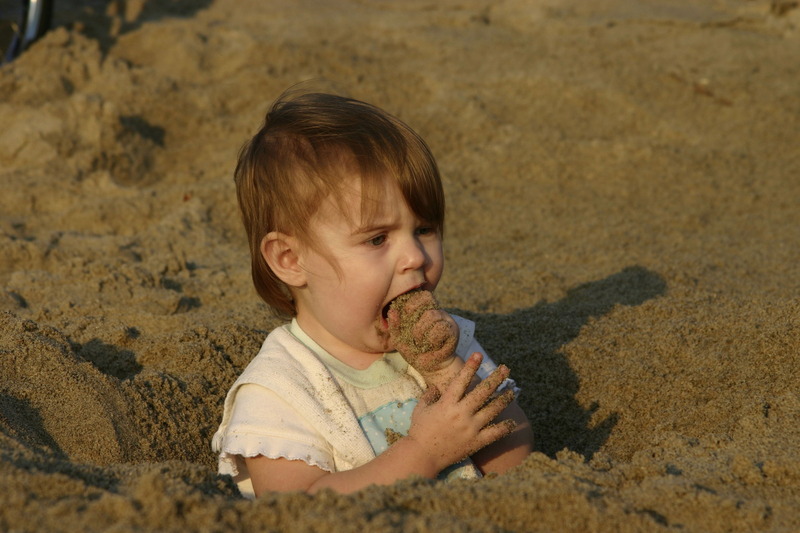 http://www.dreamstime.com/royalty-free-stock-photo-baby-eating-sand-image1414375