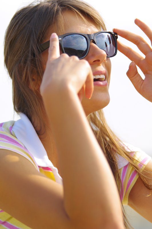 http://www.dreamstime.com/stock-image-beautiful-woman-sun-glasses-young-sitting-sunlight-black-image38974141