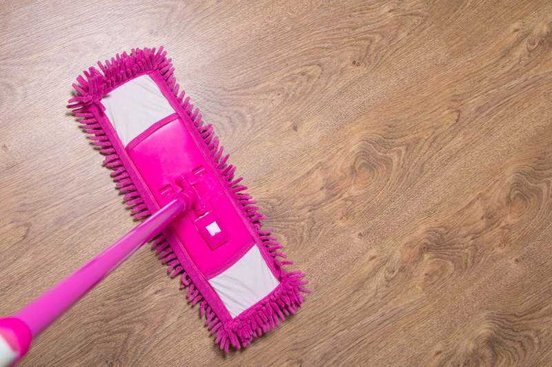 http://www.dreamstime.com/royalty-free-stock-photography-cleaning-wooden-parquet-floor-pink-mop-wet-image40193557