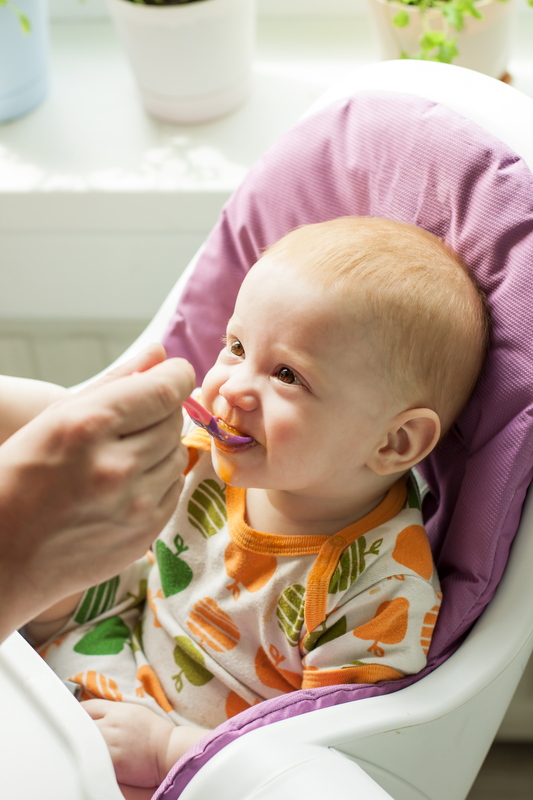 http://www.dreamstime.com/stock-image-baby-boy-eating-first-solid-food-spoon-g-very-hungry-great-pleasure-image31053581