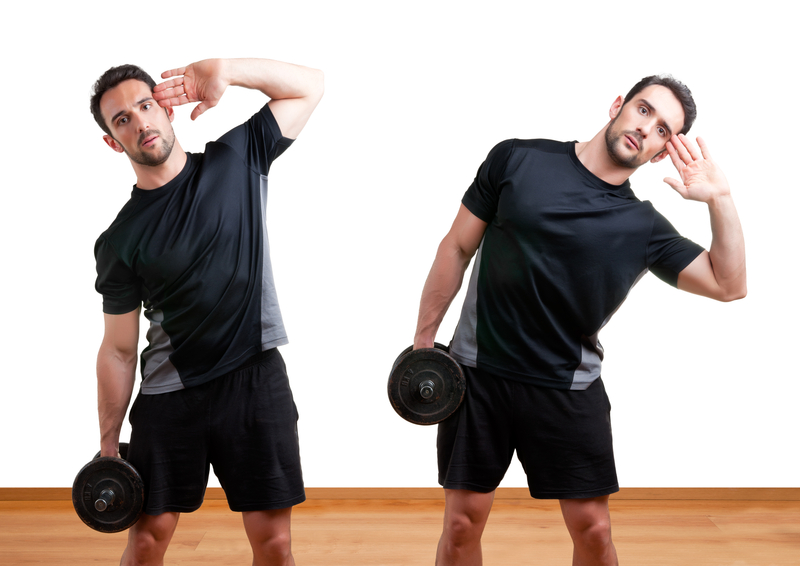 http://www.dreamstime.com/stock-photography-dumbbell-side-bend-personal-trainer-doing-bends-training-his-abs-gym-image31865002