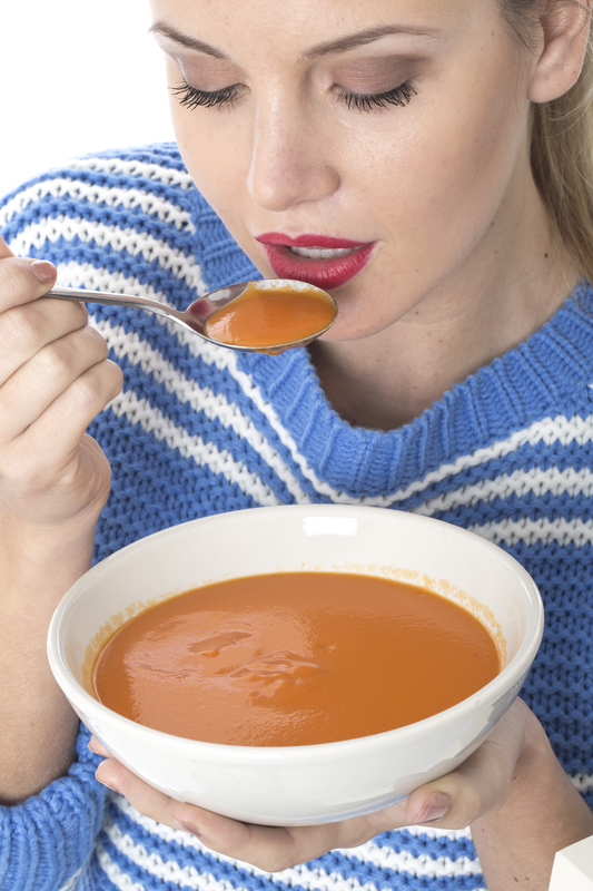 http://www.dreamstime.com/stock-images-attractive-young-woman-eating-tomato-soup-model-released-image34070704