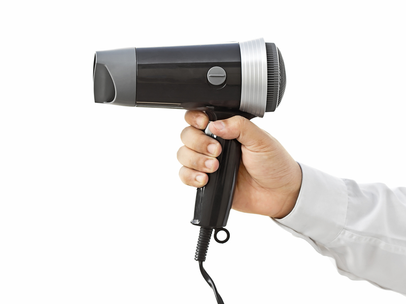 http://www.dreamstime.com/stock-images-hair-dryer-business-man-holding-image34675144