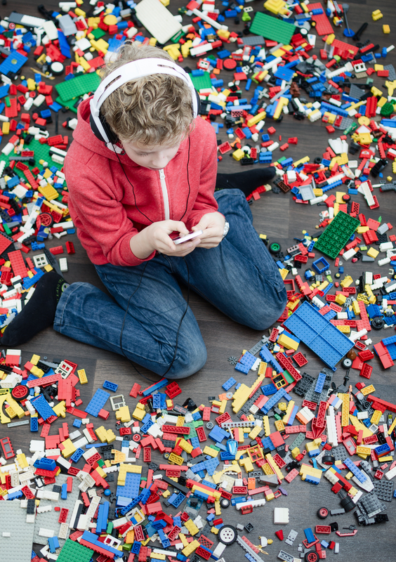 http://www.dreamstime.com/stock-photo-spoiled-kid-child-boy-to-many-toys-using-smartphone-to-play-image36179920