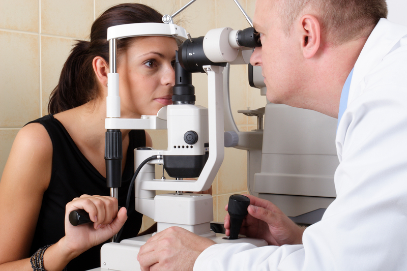http://www.dreamstime.com/stock-image-male-ophthalmologist-conducting-eye-examination-image985221