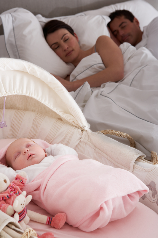 http://www.dreamstime.com/royalty-free-stock-image-newborn-baby-sleeping-cot-parents-bedroom-image19062216