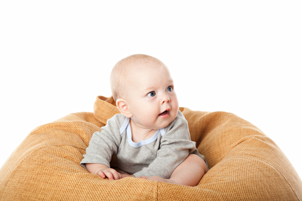 http://www.dreamstime.com/royalty-free-stock-images-little-baby-boy-sitting-bean-bag-chair-isolated-over-white-image33188249