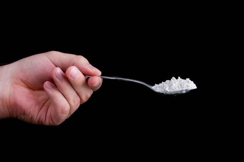 http://www.dreamstime.com/royalty-free-stock-photography-hand-holding-spoon-full-white-powder-image27245177