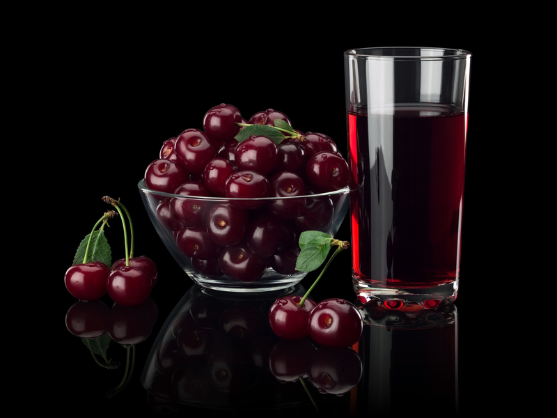 http://www.dreamstime.com/stock-photos-berries-cherry-juice-black-background-glass-vase-glass-isolated-image33648893