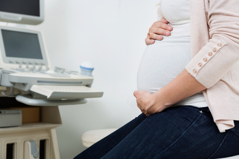 http://www.dreamstime.com/stock-photo-pregnant-woman-ultrasound-machine-clinic-midsection-background-image35682050