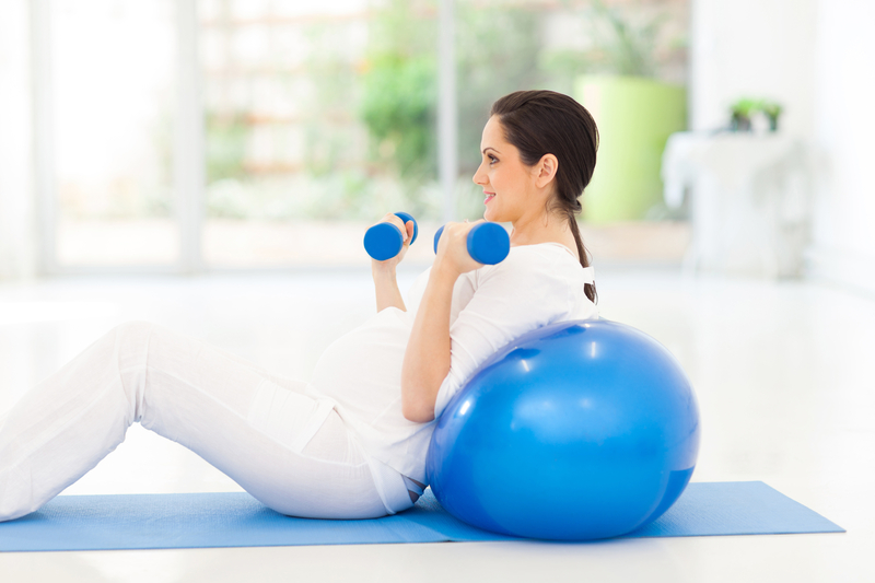 http://www.dreamstime.com/stock-photography-pregnant-woman-exercising-pretty-dumbbells-home-image33678902