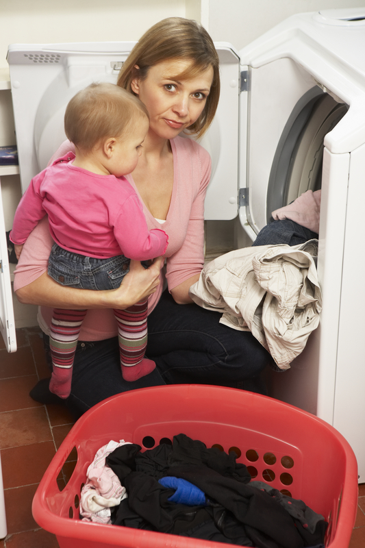 http://www.dreamstime.com/royalty-free-stock-photo-woman-doing-laundry-holding-daughter-image8688015