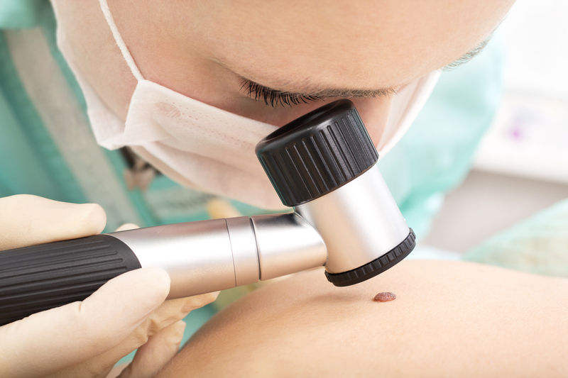 http://www.dreamstime.com/stock-photography-dermatologist-examines-birthmark-dermatoscope-test-mole-professional-dermoscopy-image30359882