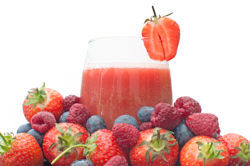 http://www.dreamstime.com/stock-photography-berry-smoothie-fruit-juice-glass-surrounded-large-pile-berries-image32119432
