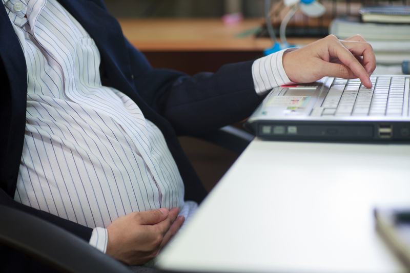 http://www.dreamstime.com/royalty-free-stock-images-pregnant-woman-sitting-office-image33840669