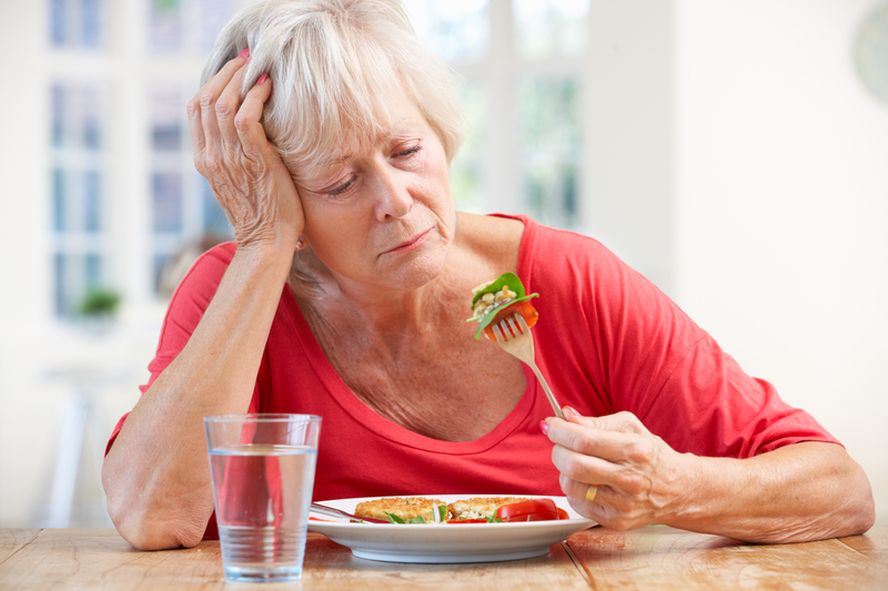 http://www.dreamstime.com/stock-photo-sick-older-woman-trying-to-eat-image25391820