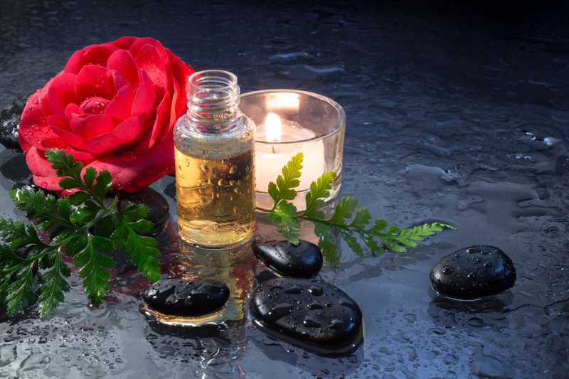 http://www.dreamstime.com/royalty-free-stock-images-fern-candle-oil-black-stones-massage-image30061009