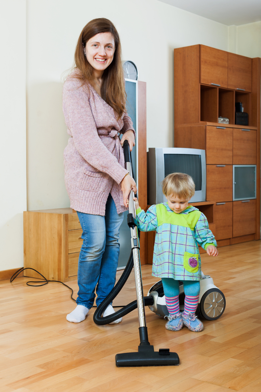 http://www.dreamstime.com/royalty-free-stock-image-mother-her-child-doing-home-cleaning-young-vacuum-cleaner-image41071106