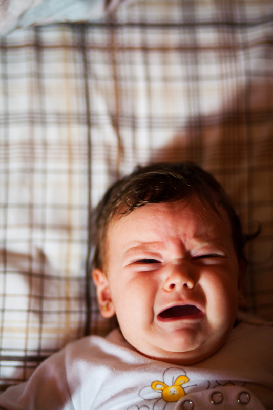 http://www.dreamstime.com/stock-image-baby-crying-portrait-sad-bed-image31520811
