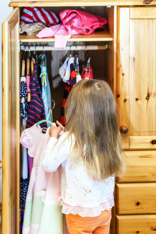 http://www.dreamstime.com/stock-photography-cute-little-girl-hanging-up-her-clothes-wardrobe-image41960592