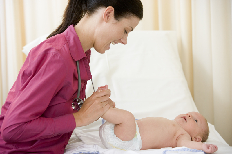 http://www.dreamstime.com/royalty-free-stock-photography-doctor-giving-checkup-to-baby-exam-room-image5929197