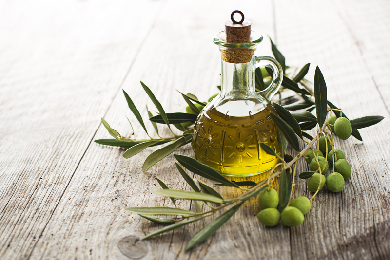 http://www.dreamstime.com/royalty-free-stock-photo-olive-oil-branch-wooden-table-image34567045