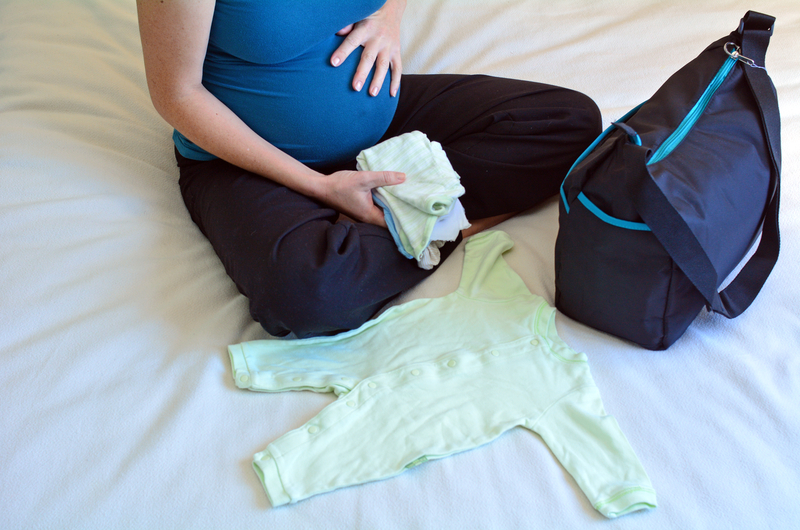 http://www.dreamstime.com/stock-photos-pregnancy-pregnant-woman-packing-hospital-bag-concept-photo-life-style-health-care-copy-space-image41823923