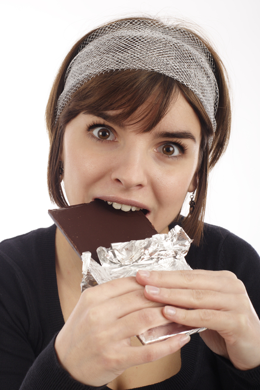 http://www.dreamstime.com/royalty-free-stock-photography-pretty-young-woman-eating-chocolate-image1992427