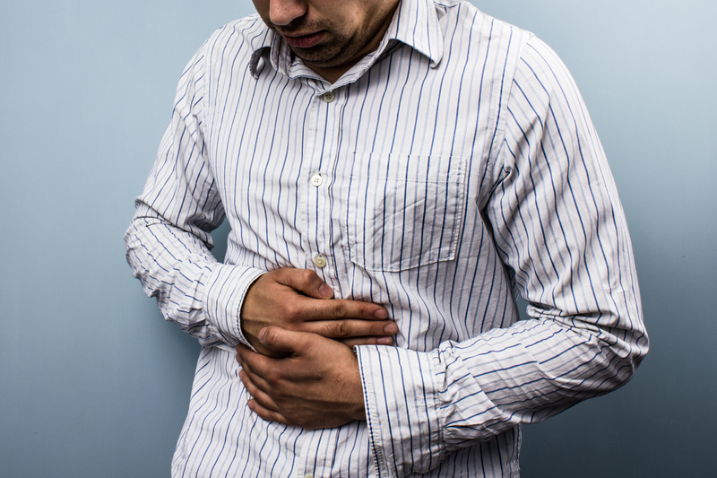 http://www.dreamstime.com/stock-photos-multi-racial-man-constipation-holding-his-stomach-image32323343