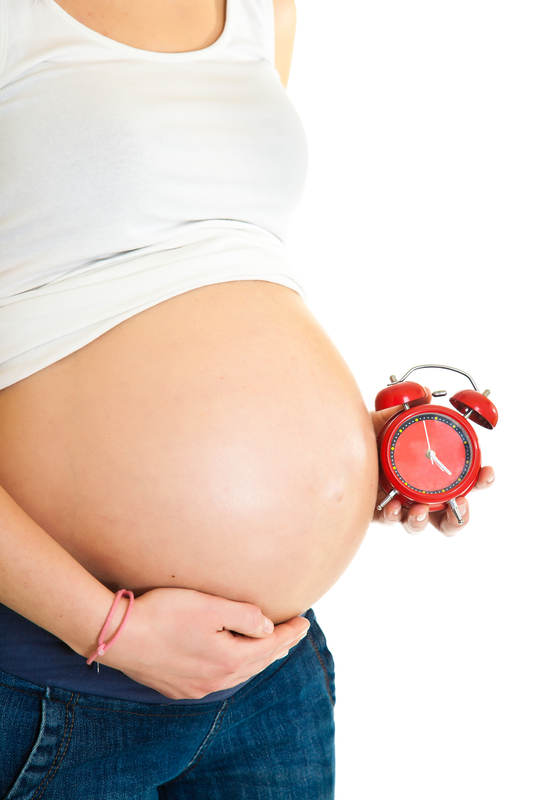 http://www.dreamstime.com/royalty-free-stock-photos-pregnant-girl-clock-image22452628