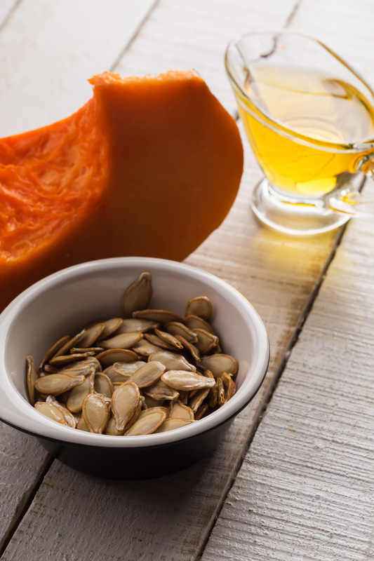 http://www.dreamstime.com/royalty-free-stock-photo-pumpkin-seeds-oil-bowl-white-wooden-table-selective-focus-image35869005