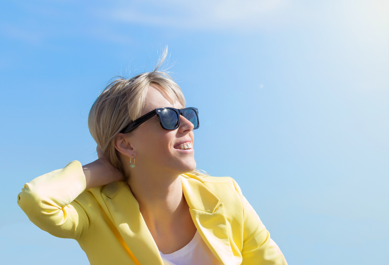 http://www.dreamstime.com/royalty-free-stock-photo-woman-wearing-sunglasses-happy-young-bright-sun-image40512545