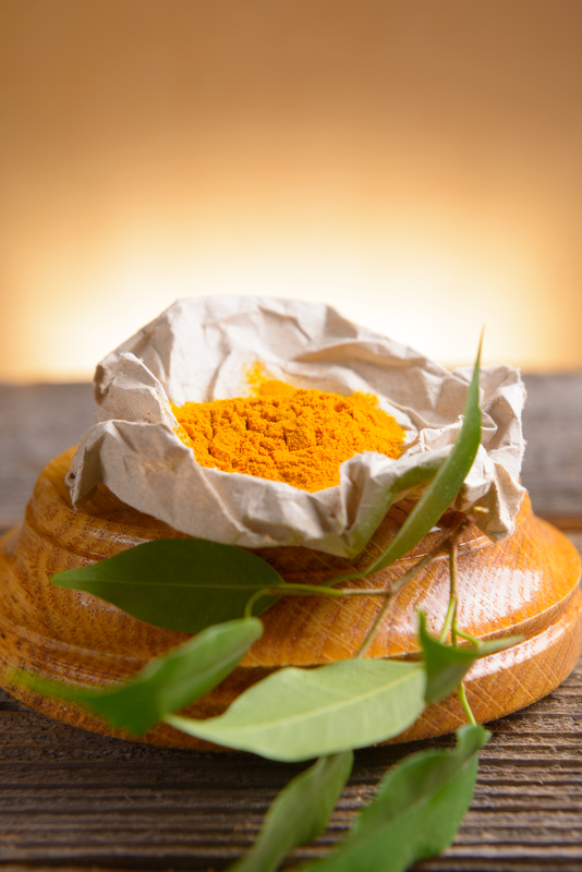 http://www.dreamstime.com/royalty-free-stock-photography-tumeric-powder-spice-wooden-board-fresh-leaves-image41526147