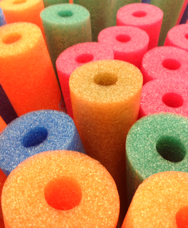 http://www.dreamstime.com/stock-image-coloured-foam-pool-noodles-abstract-background-stacked-colored-as-used-beach-image43187041